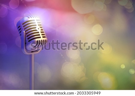 Retro microphone isolated on color background