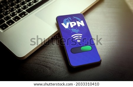 VPN - Virtual Private Network - Cyber Security and Privacy Data Encryption Software Solutions for Business concept. A smartphone with vpn app for anonymous internet using, unblock websites Royalty-Free Stock Photo #2033310410