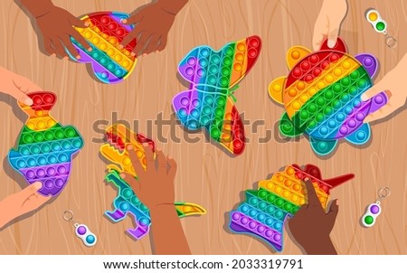 Kids playing with colourful rainbow popits in shape of heart, fish, dinosaur, sun, butterfly and unicorn. Simple dimple on wooden desk in the background. Vector graphic illustration