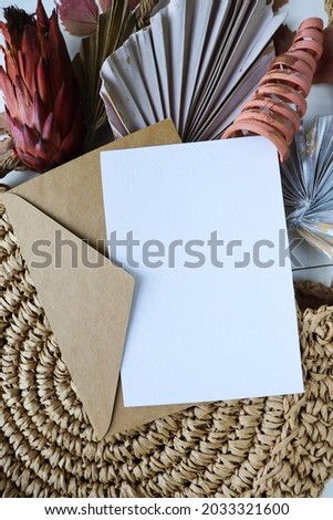 postcard  mockup. autumn composition of colorful autumn leaves and wicker straw background 