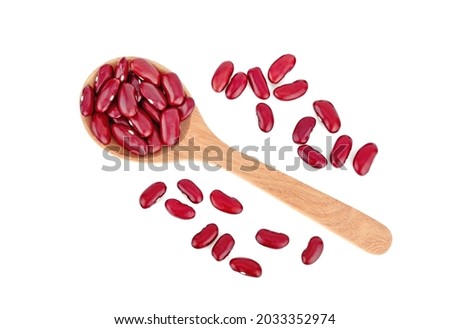 Red beans on wooden spoon isolated white background