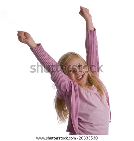 A girl in pink jumps for joy