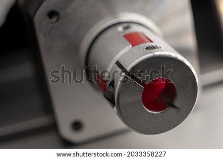 Stepper motor with aluminium coupling macro shot. Royalty-Free Stock Photo #2033358227