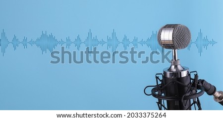 Stand with microphone on color background
