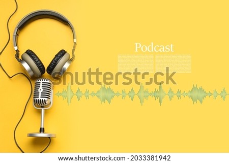 Headphones with microphone on color background with space for text