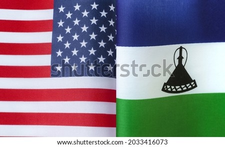 fragments of the national flags of the United States and  Kingdom of Lesotho in close-up