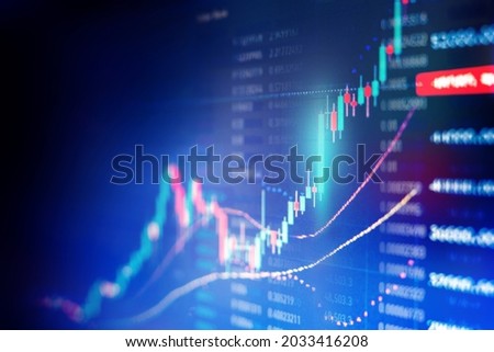 Financial graph with up trend line candlestick chart in stock market on blue color background Royalty-Free Stock Photo #2033416208