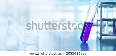 purple test tube in chemistry science research lab white blue banner background	 Royalty-Free Stock Photo #2033416853