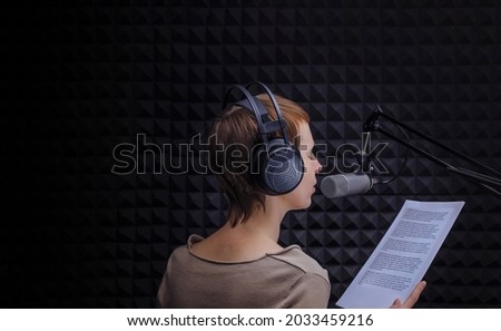 Girls announcer in the sound studio Royalty-Free Stock Photo #2033459216