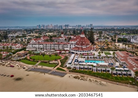 Hotel del Coronado with San Diego skyline, aerial.  Royalty-Free Stock Photo #2033467541
