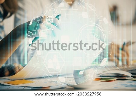 Double exposure of social network theme drawing over people taking notes background. Concept of human connection