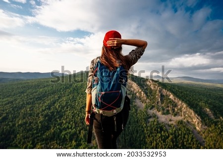 A woman is traveling in Bashkiria, Russia. Mountain tourism in Russia. Walking tour of the mountains of Bashkiria, Aigir. A trip to the mountains with a backpack. Copy space Royalty-Free Stock Photo #2033532953