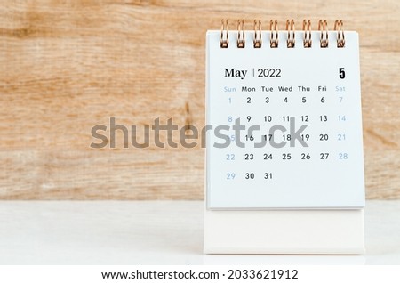 May desk Calendar 2022 on wooden table background. Royalty-Free Stock Photo #2033621912