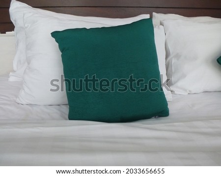 Green pillow on the bed. sofa pillow