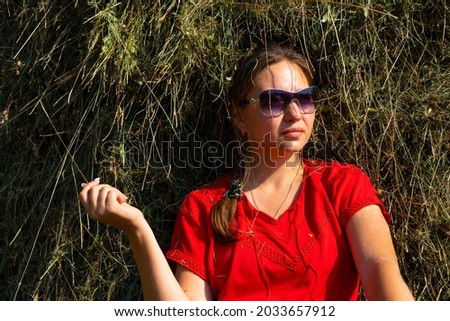 girl by the haystack in the mountains