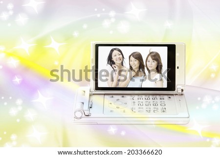 Three Women Reflected In Mobile Screen