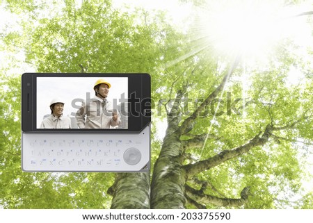 Person In Working Suit And The Fresh Green In Mobile Screen