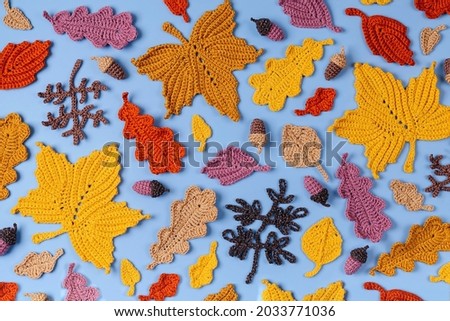 Pattern made of knitting yellow leaves. Autumn background. Fall mood 