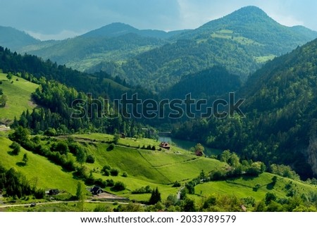 Beautiful landscape. Green forest, meadow, and mountain. True european nature. Clouds, and outstanding sunny afternoon outhdoor with fantastic view on village and lake 