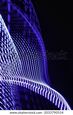Light Painting Photography, The beautiful neon light pattern, which is blue and white, very unique and gives an artistic impression and illustrates an electrical technology, Long Exposure Photography.