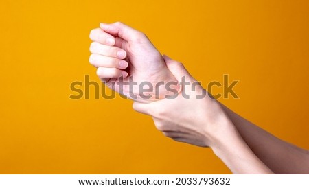 woman holds her hand - pain concept