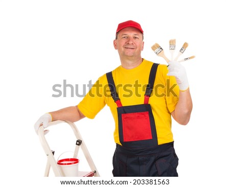 Worker shows painting brushes. Isolated on a white background.