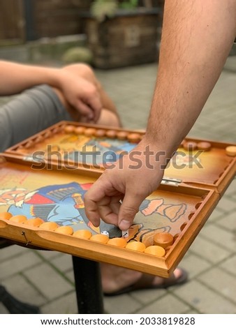 Backgammon game. Painted colored backgammon.