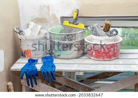 Renovation in the of apartment building. Tools for repair on a wooden platform. High quality photo