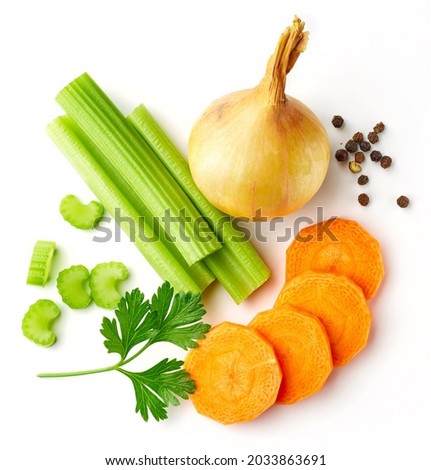 Set of spices for vegetable stock - celery sticks, carrot slices, parsley, onion and black pepper isolated on white background, from above