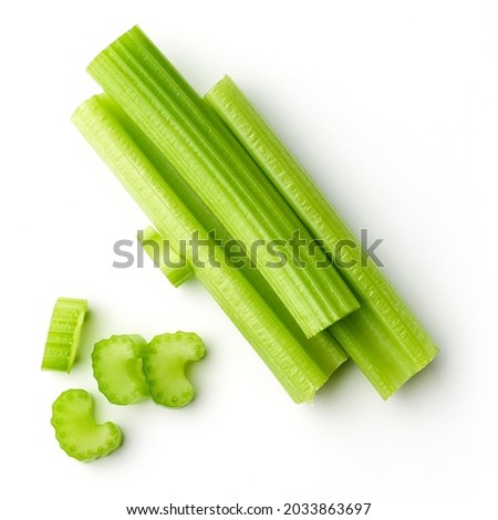 Heap of celery sticks isolated on white background, top view Royalty-Free Stock Photo #2033863697