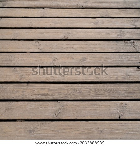 Bright wooden runway background photograph.