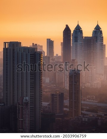 Mumbai's residential skyscrapers and highrises amidst the winter fog and light. Royalty-Free Stock Photo #2033906759