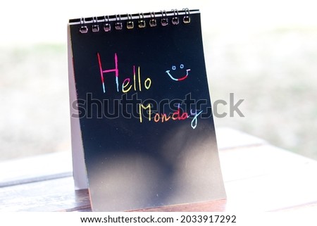 Hello Monday word write on notebook