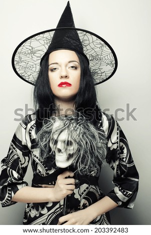 Funny Witch with skull. Holiday picture.