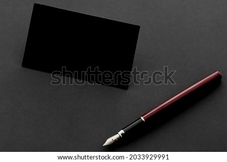 Blank black business card for mockup and pen as stationery in the office, luxury branding and corporate identity design.