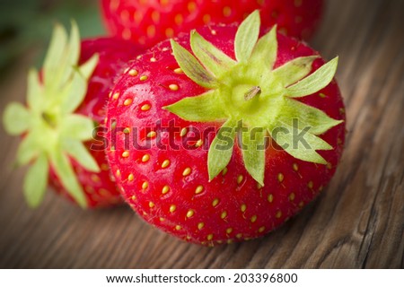 Fresh Strawberry close up on the wood