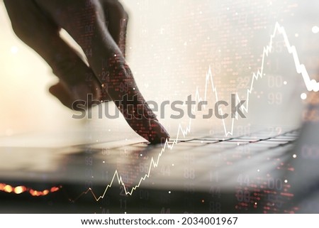 Multi exposure of abstract financial diagram with world map and with hand typing on computer keyboard on background, banking and accounting concept
