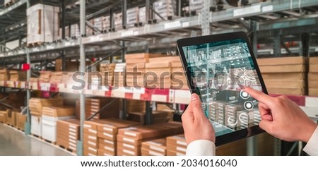 Warehouse management innovative software in computer for real time monitoring of goods package delivery . Computer screen showing smart inventory dashboard for storage and supply chain distribution . Royalty-Free Stock Photo #2034016040