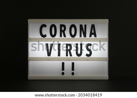 Coronavirus text on a lightbox.
