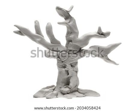 Grey modelling clay shaped in comic old tree sculpture isolated on white background