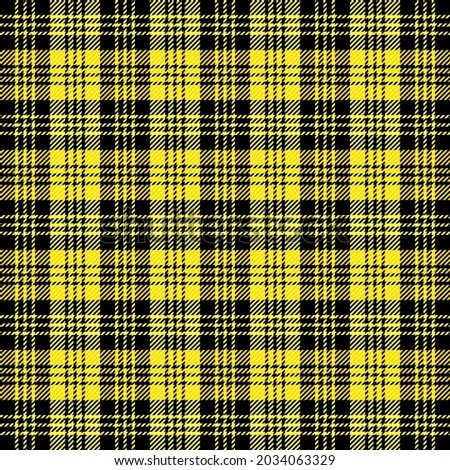 Tartan plaid. Scottish pattern in yellow and black cage. Scottish cage. Traditional Scottish checkered background. Seamless fabric texture. Vector illustration