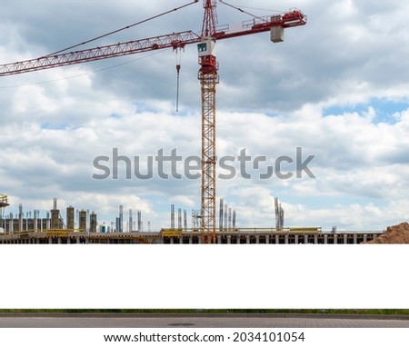 Blank white advertising banner on the construction cite fence Royalty-Free Stock Photo #2034101054