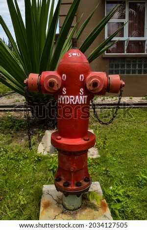 batam, indonesia. september 1st, 2021. A hydrant in the world of fire fighting is a fire protection system that  painted red for easy visibility.