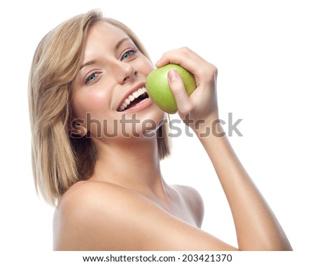 portrait of attractive  caucasian smiling woman blond isolated on white studio shot eating green apple