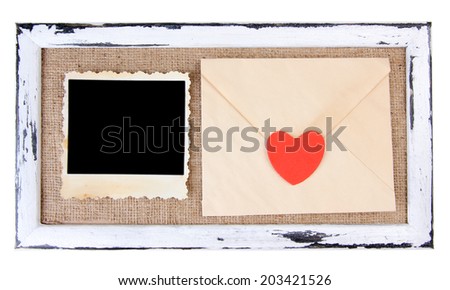 Wooden frame with blank old photo and love letter isolated on white