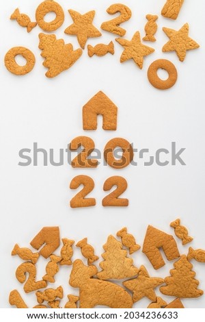 gingerbread cookies new year with animals and numbers 2022 on a white background