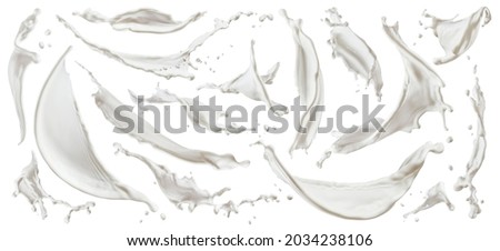 Milk splashes isolated on white background Royalty-Free Stock Photo #2034238106