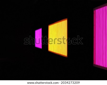 The windows of the building are closed with colorful shields