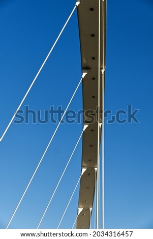 abstract photo of the detail of the tie rods of a modern suspension bridge