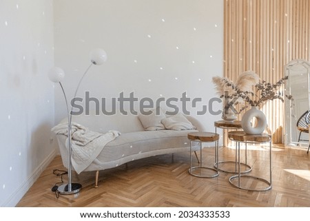 expensive modern light luxury interior design of a spacious living room with wooden elements and white walls. filled with original and unusual decorative things